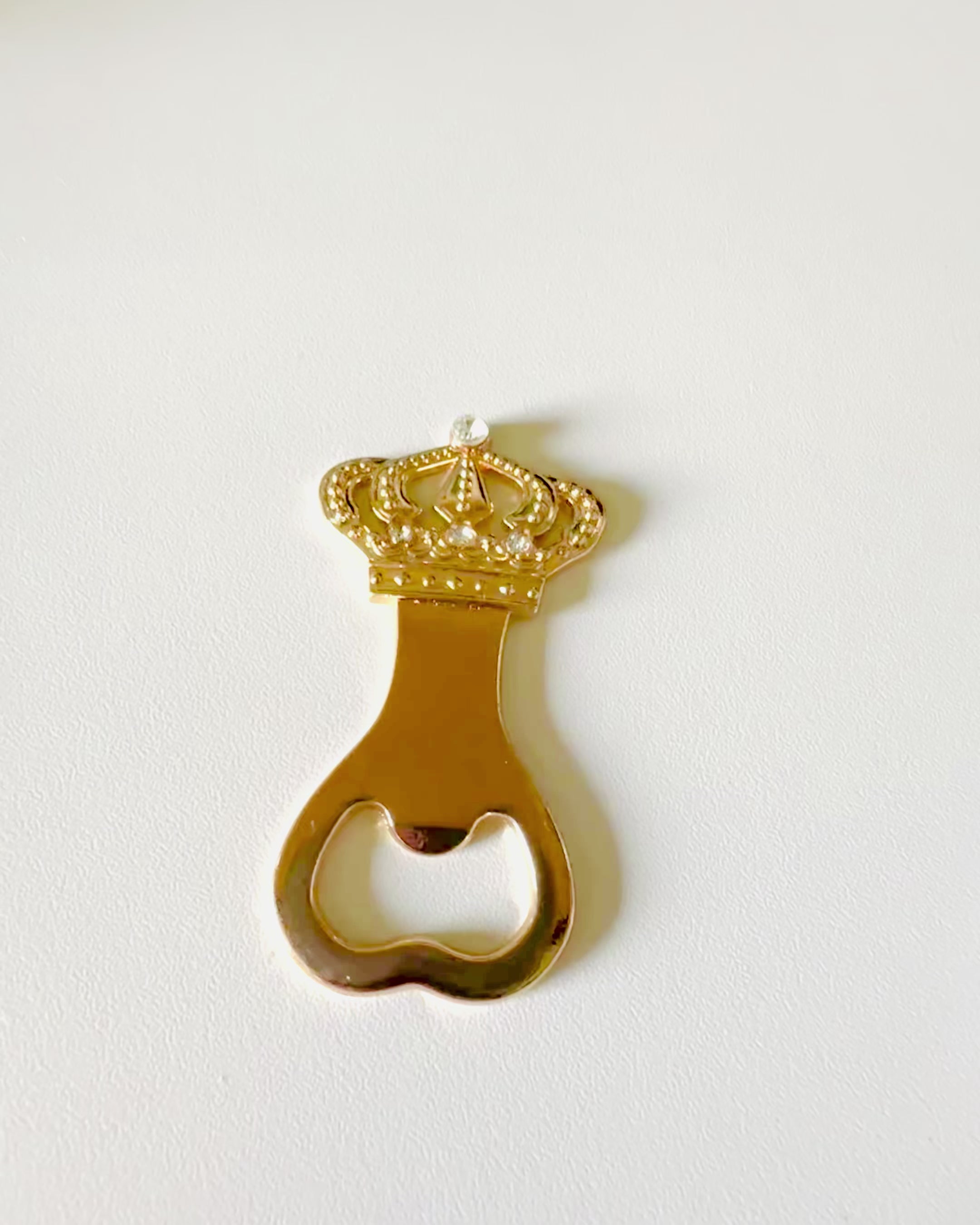 Bottle opener "King's Crown" in gold color, personalization option with engraving.